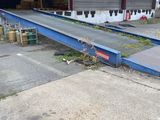 an image of a conveyor belt in a warehouse