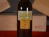 a bottle of wine that is sitting on a table
