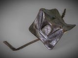 a small metal object that is hanging on a hook