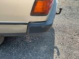 a car that is parked on a gravel lot