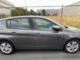 a picture of a grey car parked in a parking lot