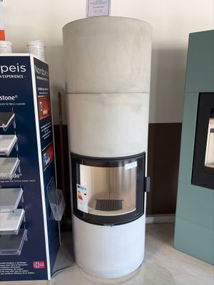 a white stove sitting next to a black and white box