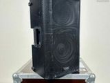 a speaker that is sitting on top of a case