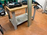 a picture of a workbench in a workshop with tools on it