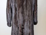 an image of a fur coat on a mannequin stand