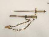 two different types of knives and chains on a white surface