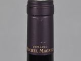 the bottle of wine is empty on the table with the label on it