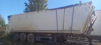 a large white truck that is parked on the side of the road