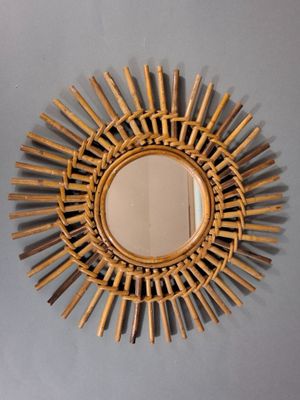a mirror that is hanging on the wall in the room