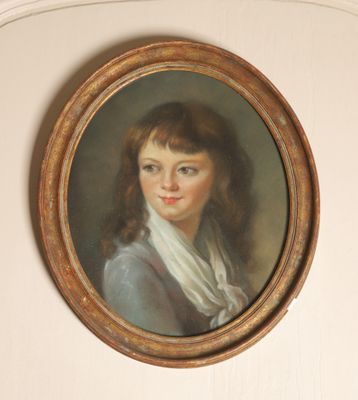 portrait of a young woman in a blue dress with a white scarf