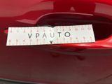 a picture of a sticker on the hood of a red car