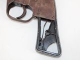 an old gun that is sitting on a table