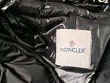 black moncler down jacket with white moncler logo on it