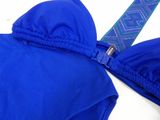 a close up of a blue bikini top with a tie on it