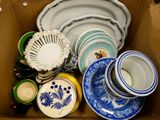 a box full of plates and bowls in it