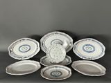 six pieces of blue and white porcelain dishes and plates on a table