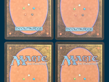 four decks of magic the gathering cards are shown on a blue background