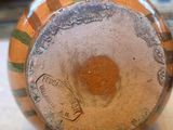a close up of a vase on a table