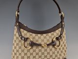 guccissi gg canvas and leather shoulder bag