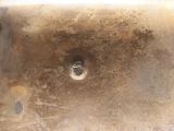 a close up of a metal sink with a metal faucet