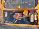 a close up of a machine with a hose attached to it