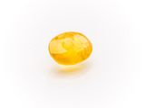 a yellow sapphire stone on a white background