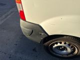 a white van parked on the side of the road