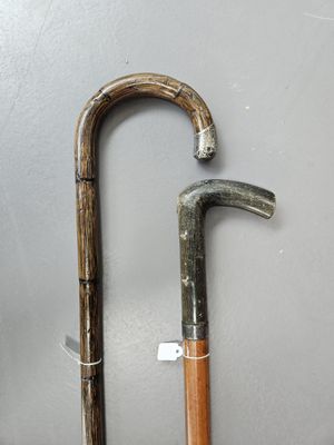 two old walking canes that are next to each other