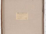 an old photo of a white frame with a label on it