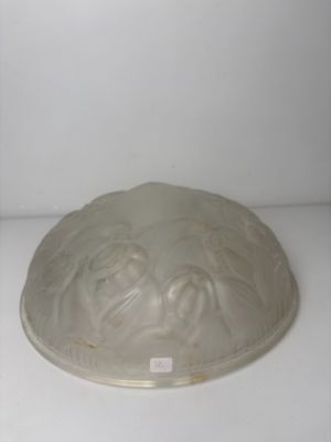 a glass bowl with a lid on a white surface