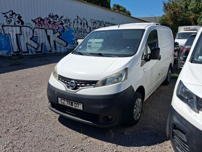 a white van parked next to a white van in a parking lot