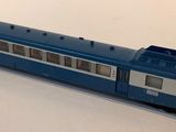 a toy train that is sitting on a white surface