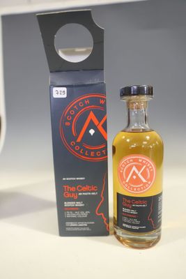 an image of a bottle of alcohol sitting next to a box