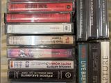 a lot of cassettes in a clear case on a table