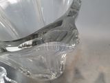 a close up of a broken glass vase on a table