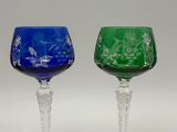 pair of green and blue glass goblets on a white background