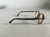 a pair of glasses sitting on a white surface