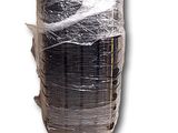 a roll of plastic wrapped up on a white surface