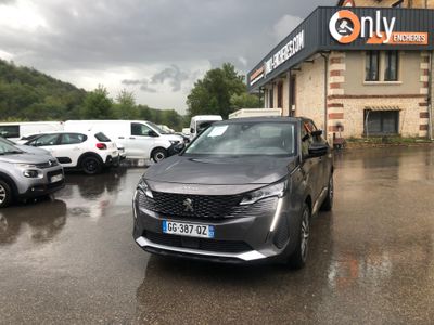 many cars parked in front of a building on a rainy day