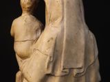 a statue of a woman holding a child in her arms