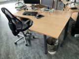 a desk with two monitors and a keyboard on it