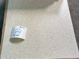 a cardboard box with a roll of tape on top of it