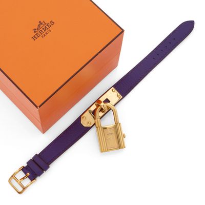 a close up of a purple belt with a padlock on it