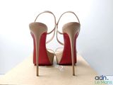 a pair of high heeled shoes sitting on top of a box