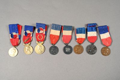 five medals that are on display on a table