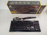 a black keyboard and a black mouse on a white table