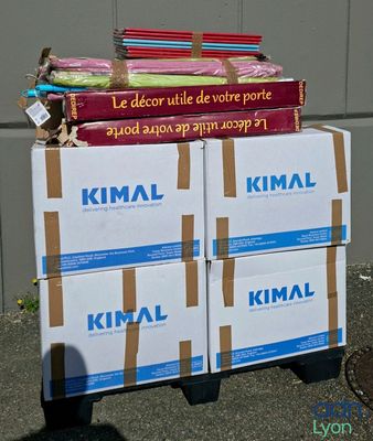 several boxes stacked on top of each other on a sidewalk