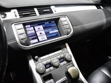the interior of a car with a steering wheel and dashboard controls