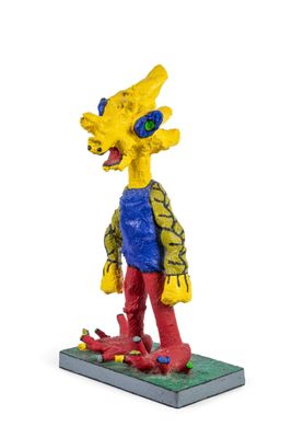 the simpsons figurine is standing on a base with a skateboard in his hand