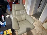 a chair that is sitting in the middle of a living room